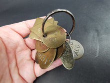 Load image into Gallery viewer, Antique Brass and Silver Numbered Key Tags from Glasgow Scotland Police Station Property Recovery Set of 11 Different Shapes and Sizes