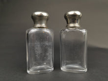 Load image into Gallery viewer, Antique Traveling Toiletry or Perfume Bottles Clear Glass with Silver Metal Tops Early 1900's Pair Set of 2