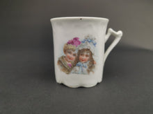 Load image into Gallery viewer, Antique Children's Tea Cup Mug with Boy and Girl Victorian Original Late 1800's Ceramic Bisque Porcelain