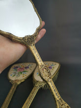 Load image into Gallery viewer, Vintage Vanity Hand Mirrors and Hair Brush Set of 3 with Floral Petite Point Flowers Embroidery Gold Filigree Metal and Beveled Glass 1930's