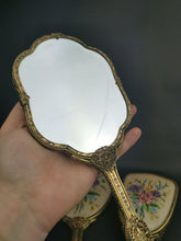 Load image into Gallery viewer, Vintage Vanity Hand Mirrors and Hair Brush Set of 3 with Floral Petite Point Flowers Embroidery Gold Filigree Metal and Beveled Glass 1930's
