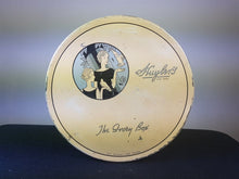 Load image into Gallery viewer, Vintage Art Deco Huyler&#39;s Chocolate Tin Box with Flapper Lady 1920&#39;s Original Beige Blue and Black Round
