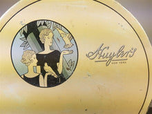 Load image into Gallery viewer, Vintage Art Deco Huyler&#39;s Chocolate Tin Box with Flapper Lady 1920&#39;s Original Beige Blue and Black Round
