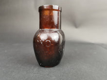 Load image into Gallery viewer, Antique Oxo Jar Amber Glass 1910
