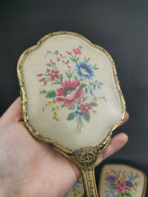 Load image into Gallery viewer, Vintage Vanity Hand Mirrors and Hair Brush Set of 3 with Floral Petite Point Flowers Embroidery Gold Filigree Metal and Beveled Glass 1930&#39;s
